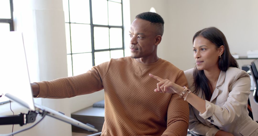 Business Collaboration: Coworkers Engaged in Project Discussion