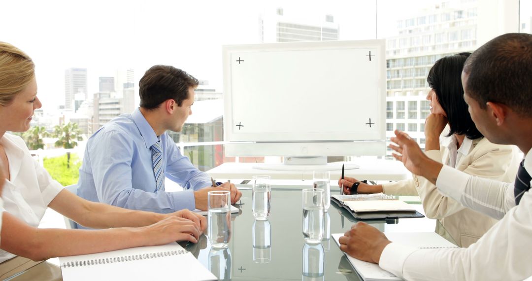 Diverse Business Team Discussing Strategy in Office Meeting - Free Images, Stock Photos and Pictures on Pikwizard.com