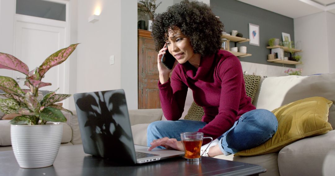 Woman Working From Home on Laptop While Talking on Phone - Free Images, Stock Photos and Pictures on Pikwizard.com