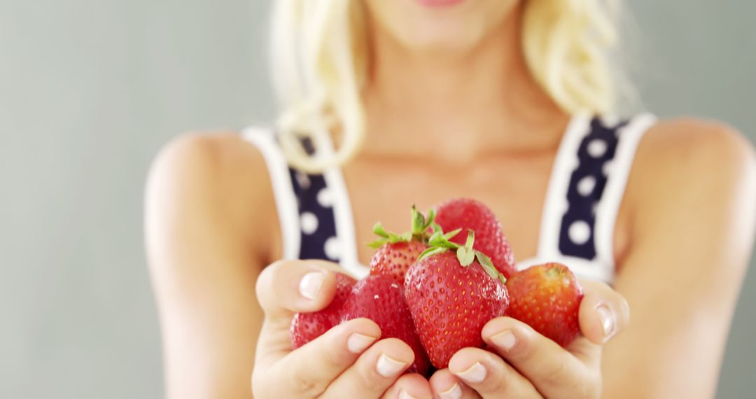 Young Woman Holding Fresh Organic Strawberries - Free Images, Stock Photos and Pictures on Pikwizard.com