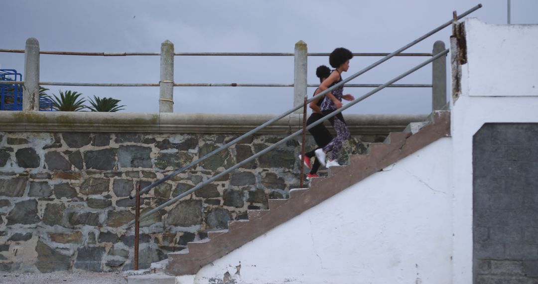 Mother and Child Running Up Staircase in Outdoor Workout - Free Images, Stock Photos and Pictures on Pikwizard.com