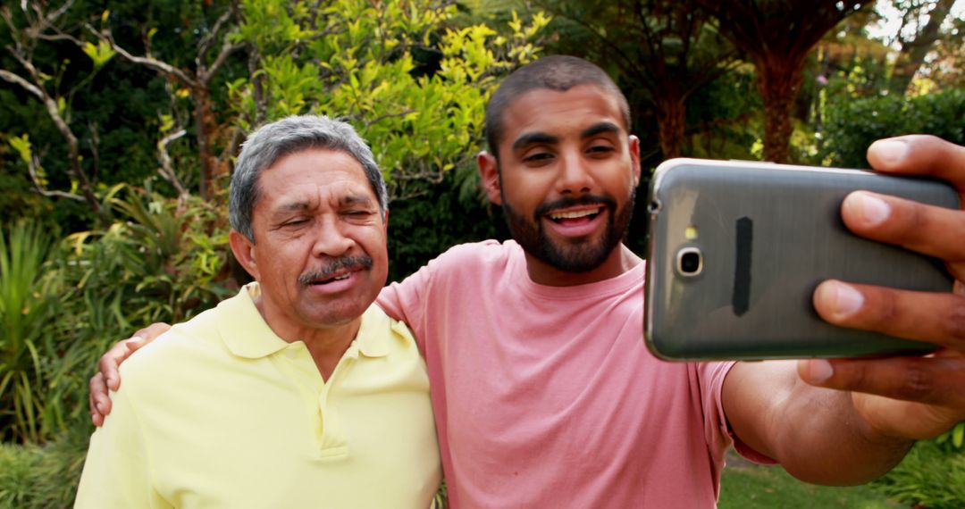 Happy Grandfather and Grandson Taking Selfie in Garden - Free Images, Stock Photos and Pictures on Pikwizard.com