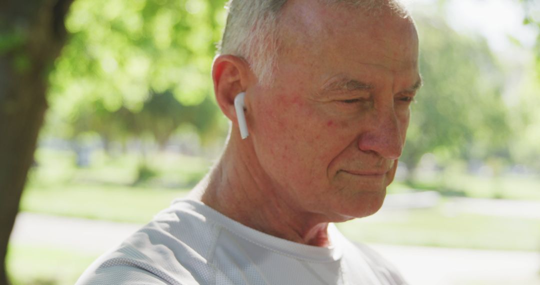 Senior Man Enjoying Music Outdoors with Wireless Earbuds - Free Images, Stock Photos and Pictures on Pikwizard.com