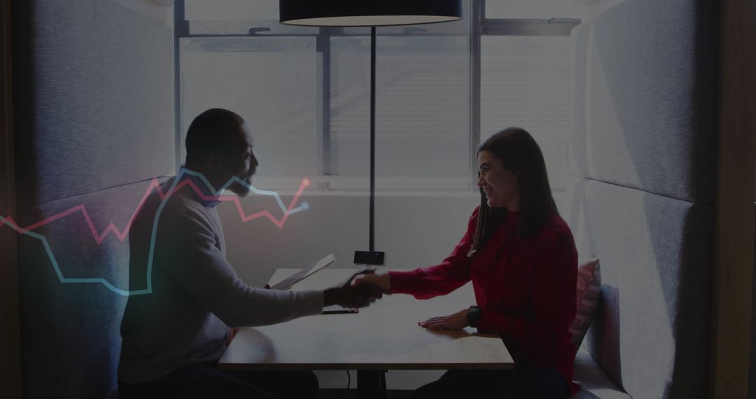 Confident Business Meeting Shaking Hands in Modern Office Booth
