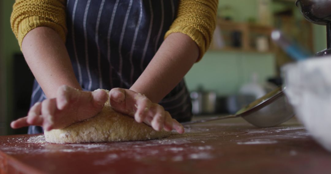 Woman Kneading Dough on Wooden Counter in Domestic Kitchen - Free Images, Stock Photos and Pictures on Pikwizard.com