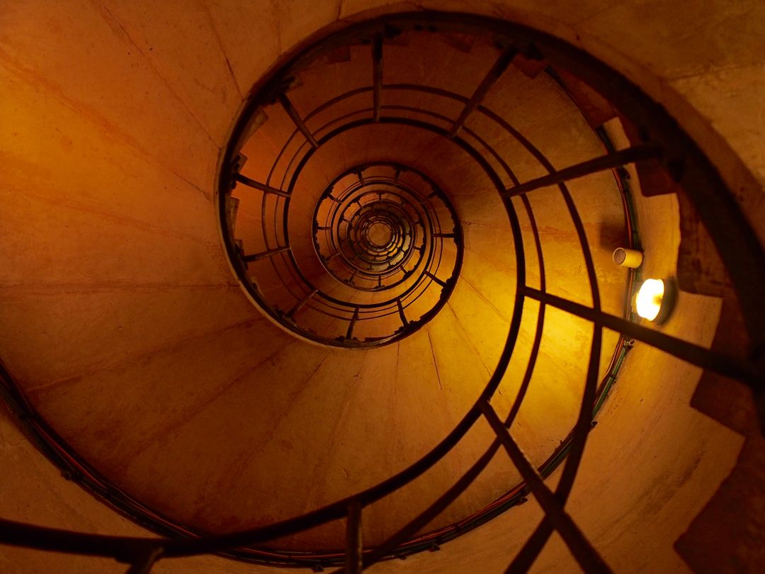 Spiral Staircase with Warm Lighting and Industrial Design - Free Images, Stock Photos and Pictures on Pikwizard.com