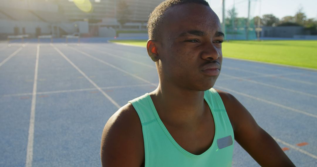 Young Male Athlete Preparing For Track Training In Stadium At Sunrise - Free Images, Stock Photos and Pictures on Pikwizard.com