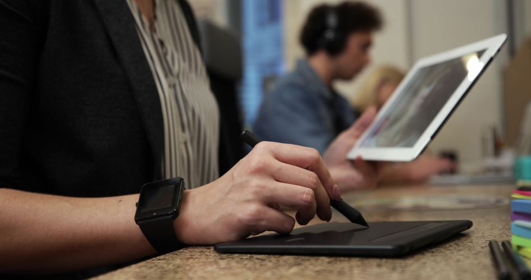 Creative Colleagues Collaborating in Modern Office with Technology