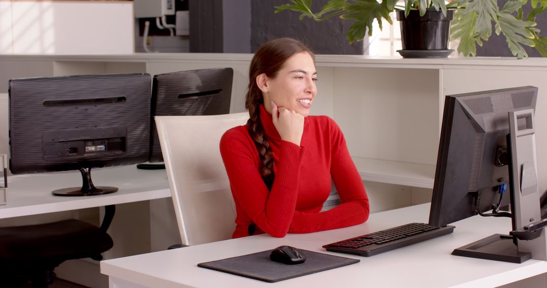 Smiling Professional Engaging in Video Conference Call at Office Desk