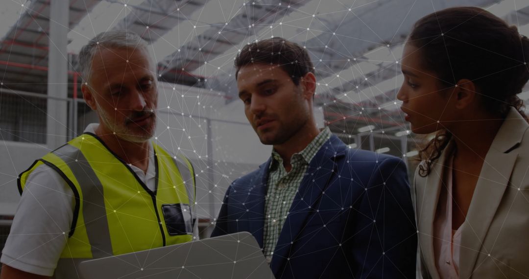 Warehouse Team Collaborating on Logistics Strategy with Digital Assistance