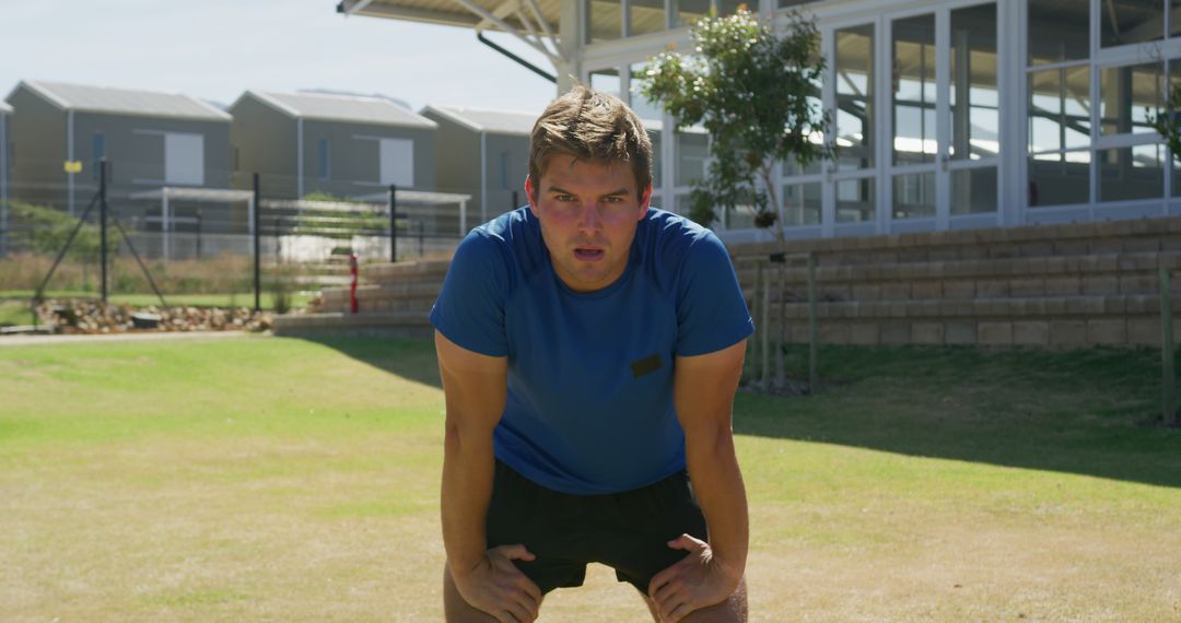 Male Athlete Pausing for Breath During Outdoor Workout - Free Images, Stock Photos and Pictures on Pikwizard.com