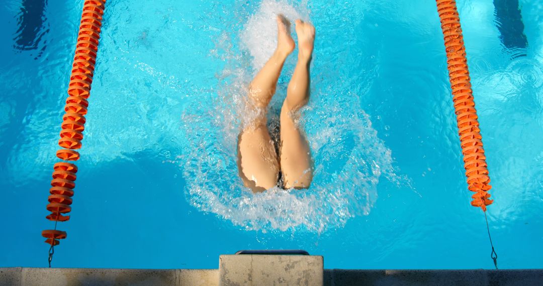 Swimmer Diving into Pool Creating Splash - Free Images, Stock Photos and Pictures on Pikwizard.com