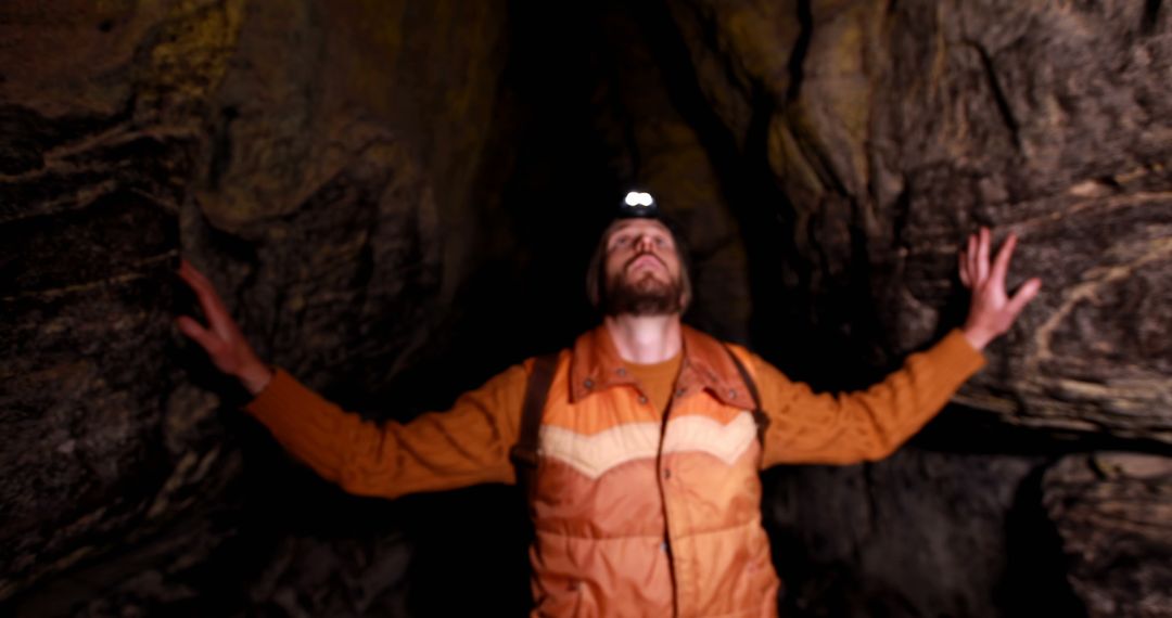 Adventurous Man Exploring Cave with Headlamp in Wildlife Adventure - Free Images, Stock Photos and Pictures on Pikwizard.com