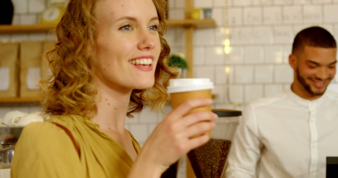 Smiling Woman Enjoying Coffee in a Café - Free Images, Stock Photos and Pictures on Pikwizard.com