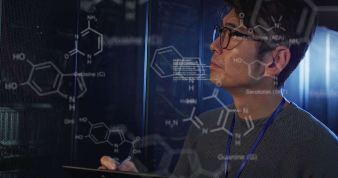 Engineer Analyzing Complex Chemical and Data Structures in Server Room