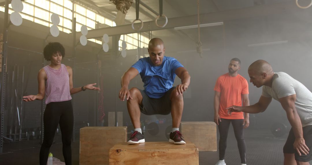 Group Training Session with Trainer Guiding Box Jump Exercise - Free Images, Stock Photos and Pictures on Pikwizard.com