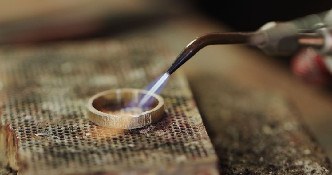 Close-Up of Jeweler Soldering Metal Ring in Workshop - Free Images, Stock Photos and Pictures on Pikwizard.com