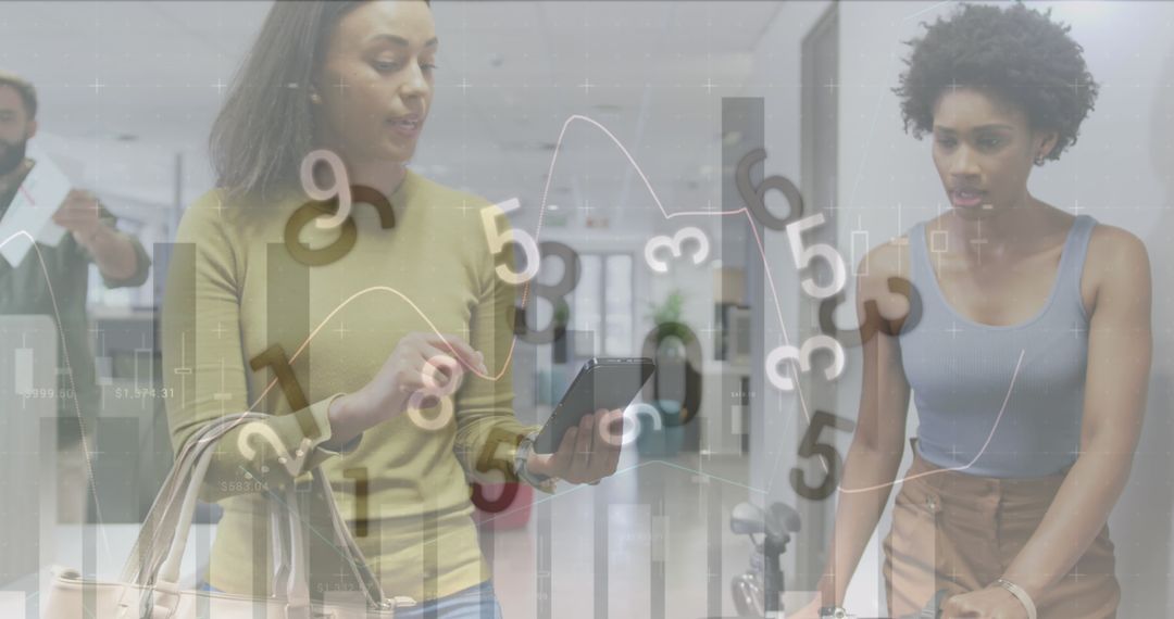 Co-workers Analyzing Financial Data Overlay in Modern Office