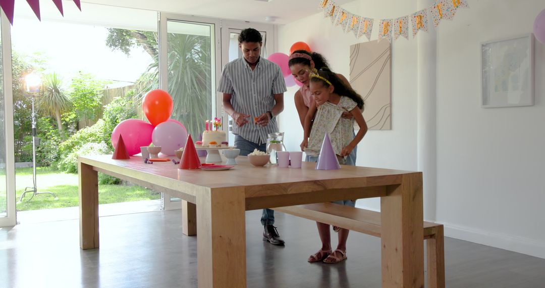 Family Preparing Birthday Party Table at Home