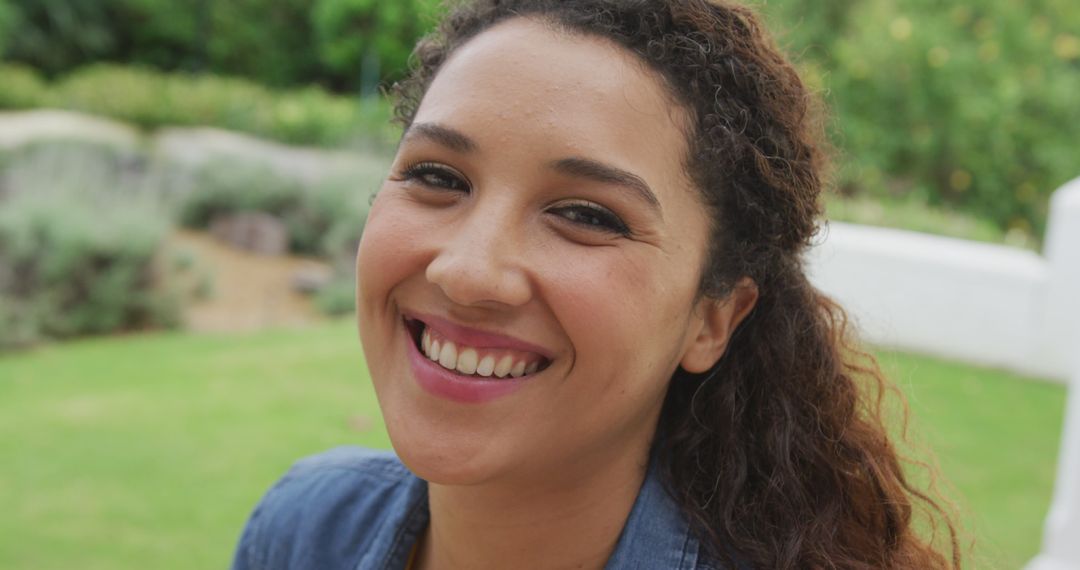Image of happy biracial women smiling in the garden - Free Images, Stock Photos and Pictures on Pikwizard.com