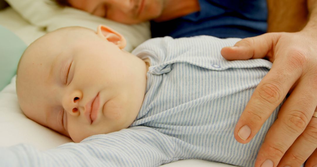 Peaceful Baby Sleeping with Protective Parent - Free Images, Stock Photos and Pictures on Pikwizard.com