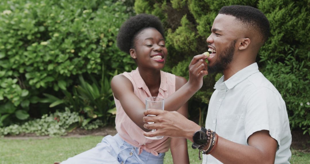 Couple Enjoying Picnic in Lush Garden Setting