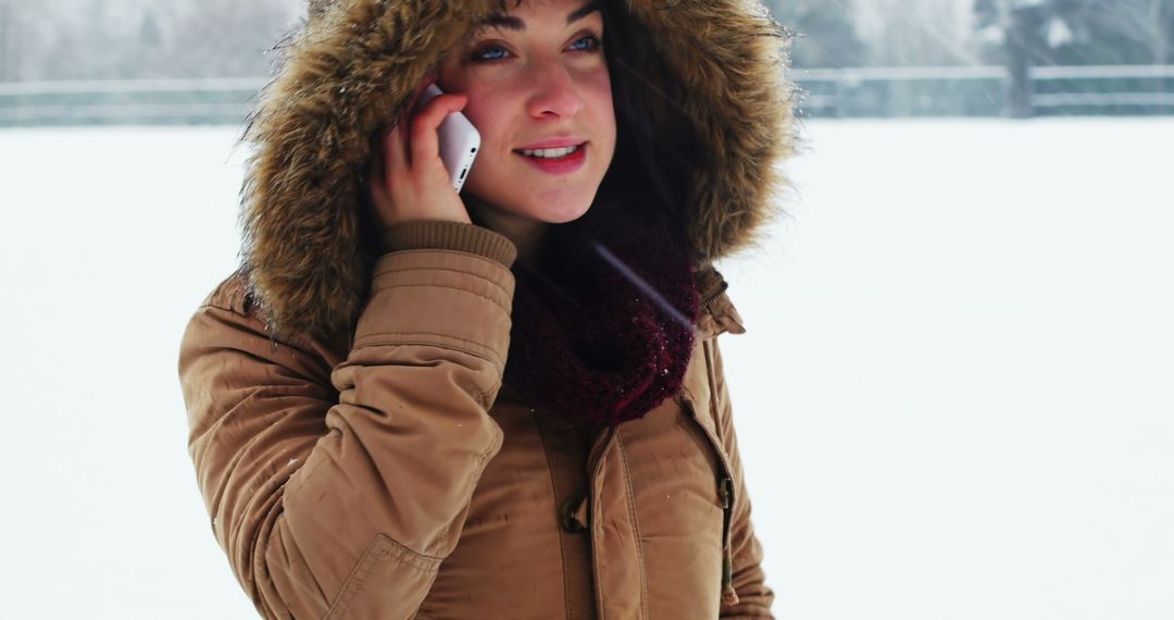 Woman Talking on Phone Outside During Winter - Free Images, Stock Photos and Pictures on Pikwizard.com