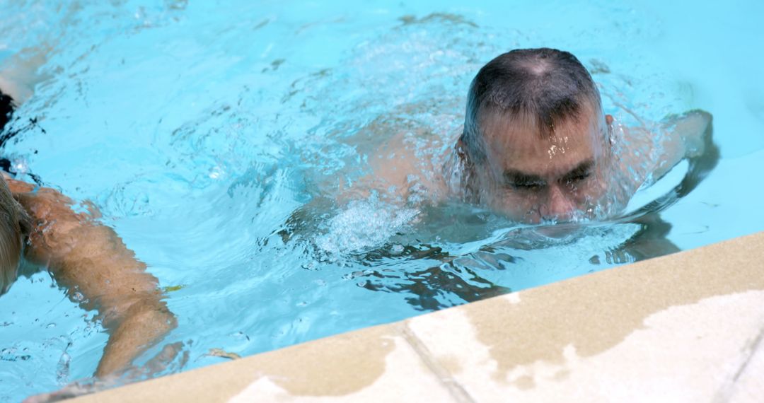 Man swimming in pool on sunny day - Free Images, Stock Photos and Pictures on Pikwizard.com