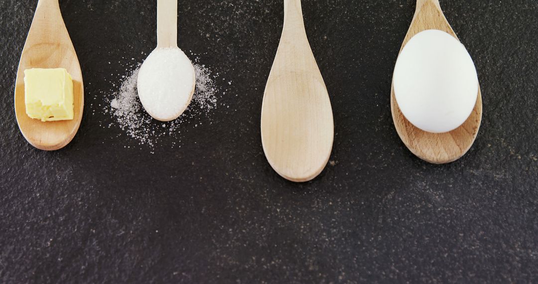 Cooking Ingredients on Wooden Spoons - Butter, Sugar and Egg - Free Images, Stock Photos and Pictures on Pikwizard.com