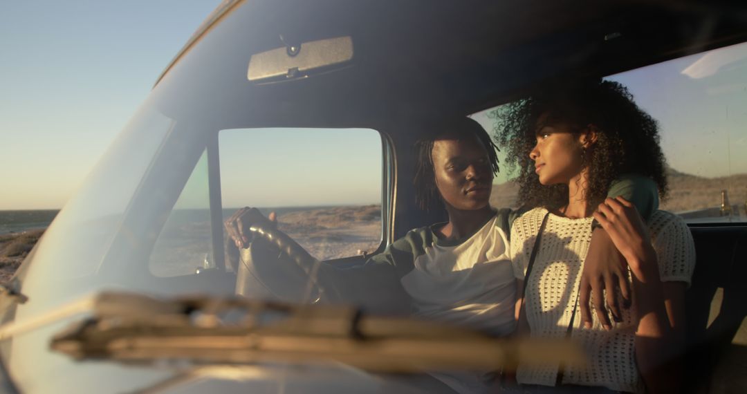 Young Couple Driving on Deserted Beach Road at Sunset - Free Images, Stock Photos and Pictures on Pikwizard.com