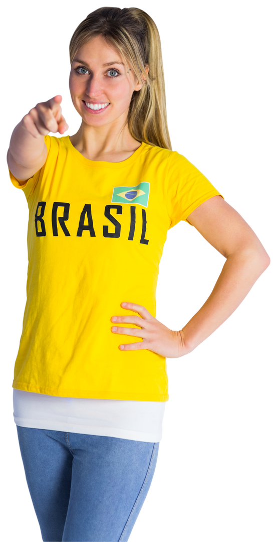 Cheerful Football Fan in Transparent Brasil T-Shirt Pointing Forward - Download Free Stock Images Pikwizard.com