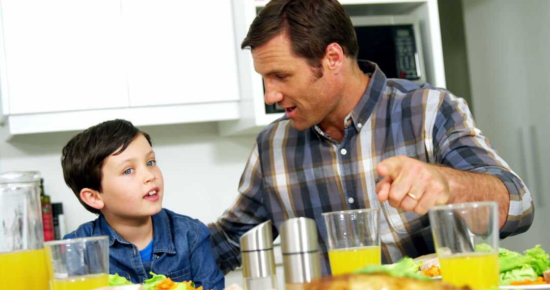 Father and Son Sharing Healthy Breakfast at Home - Free Images, Stock Photos and Pictures on Pikwizard.com