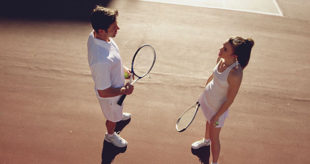 Tennis players chatting on court during break - Free Images, Stock Photos and Pictures on Pikwizard.com