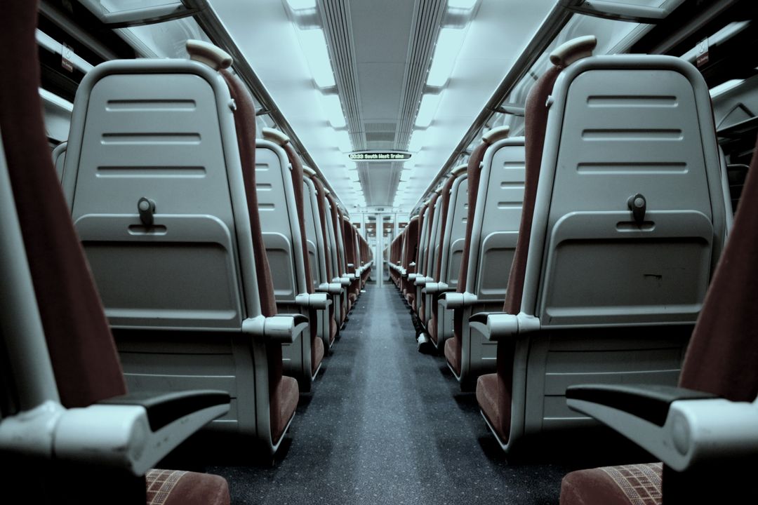 Empty Train Interior with Symmetrical Reserved Seats - Free Images, Stock Photos and Pictures on Pikwizard.com