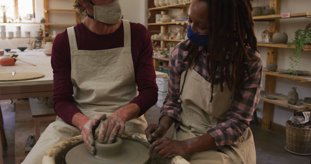 Diverse Pottery Class Engaging Students Wearing Face Masks - Free Images, Stock Photos and Pictures on Pikwizard.com