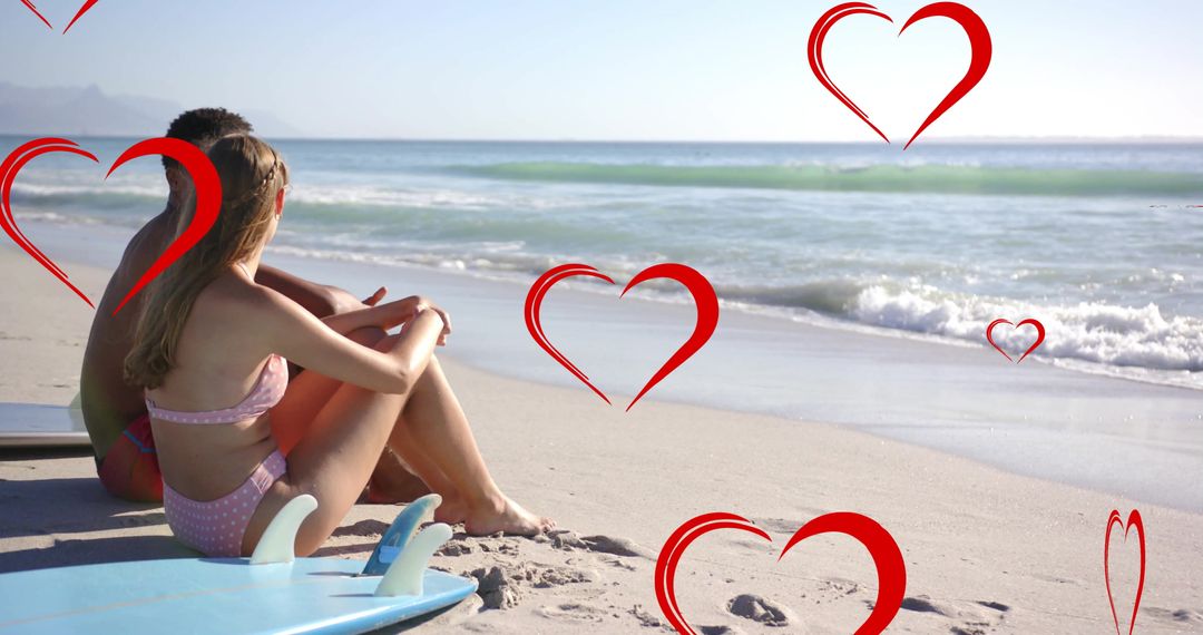 Romantic Couple on Beach Overlaid with Red Hearts