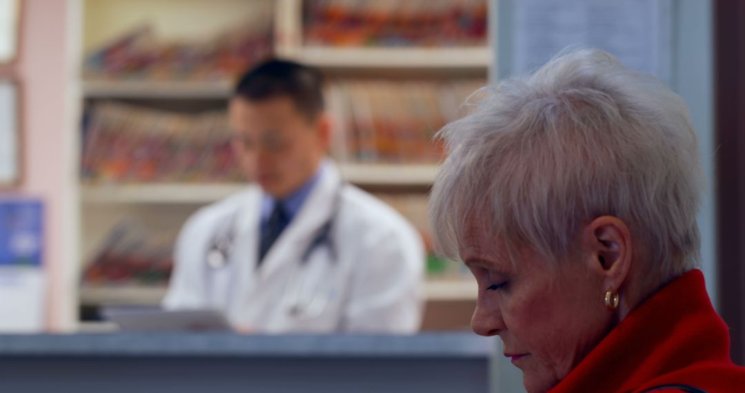 Elderly Patient Waiting in Pharmacy with Pharmacist in Background - Free Images, Stock Photos and Pictures on Pikwizard.com