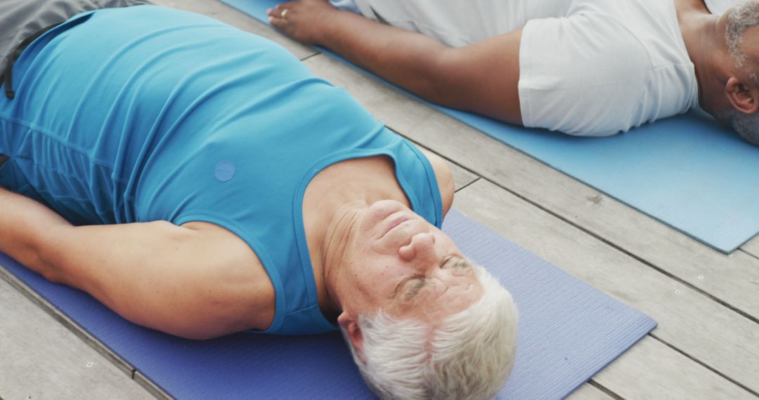 Senior Men Practicing Relaxation Technique on Yoga Mats - Free Images, Stock Photos and Pictures on Pikwizard.com