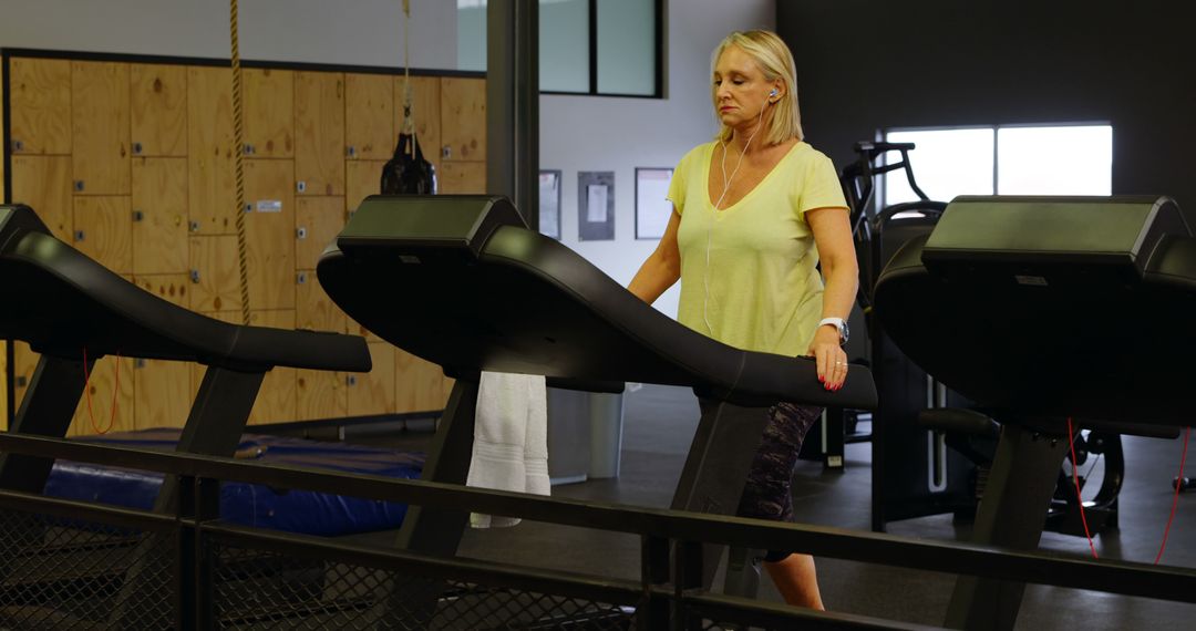 Senior Woman Exercising on Treadmill in Modern Gym - Free Images, Stock Photos and Pictures on Pikwizard.com