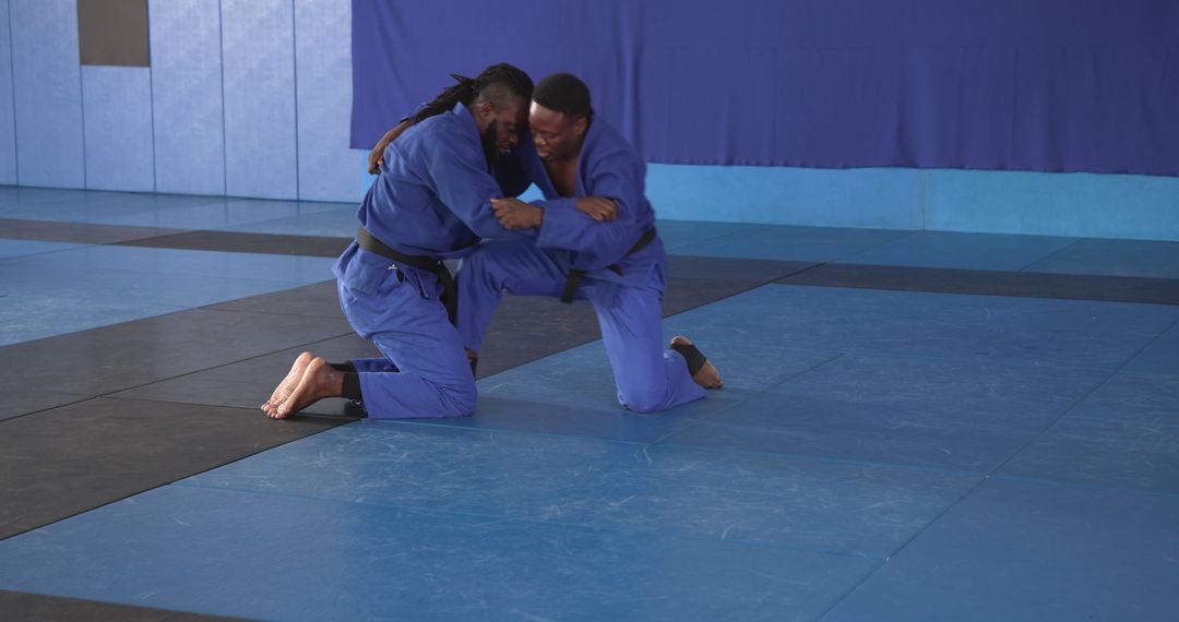 Martial Artists Engaging Vigorous Grappling Session Dojo