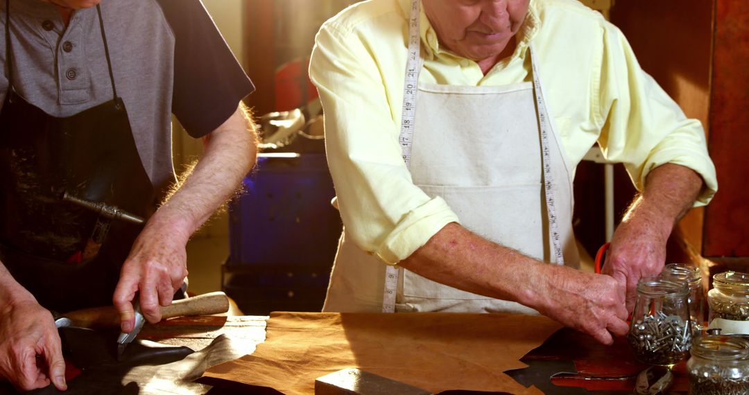 Experienced Artisans Working with Leather in Workshop - Free Images, Stock Photos and Pictures on Pikwizard.com