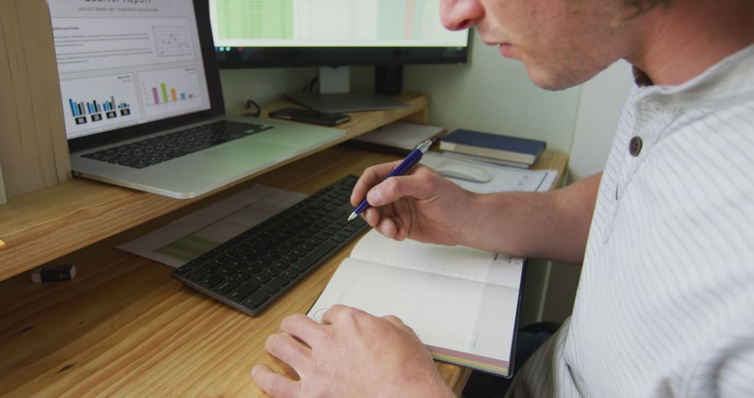 Man Writing Notes while Working from Home Office - Free Images, Stock Photos and Pictures on Pikwizard.com