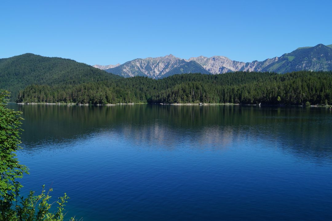Scenic View of Lake and Mountains Against Clear Blue Sky - Free Images, Stock Photos and Pictures on Pikwizard.com