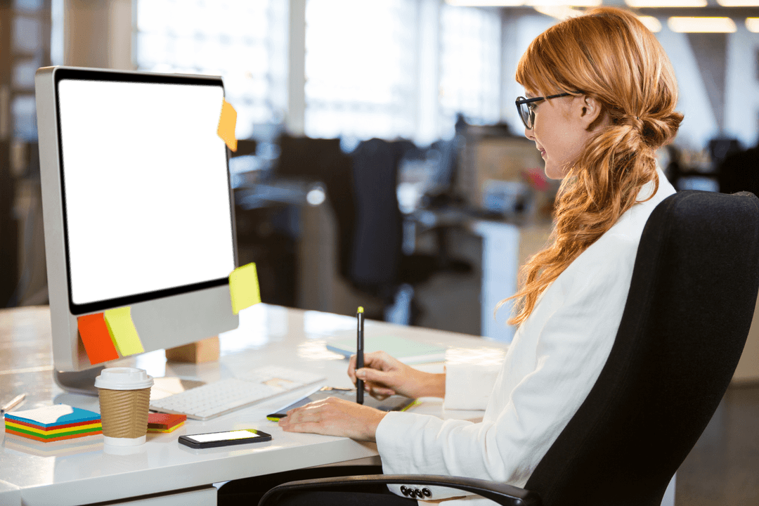Businesswoman Using Graphics Tablet by Transparent Computer Screen