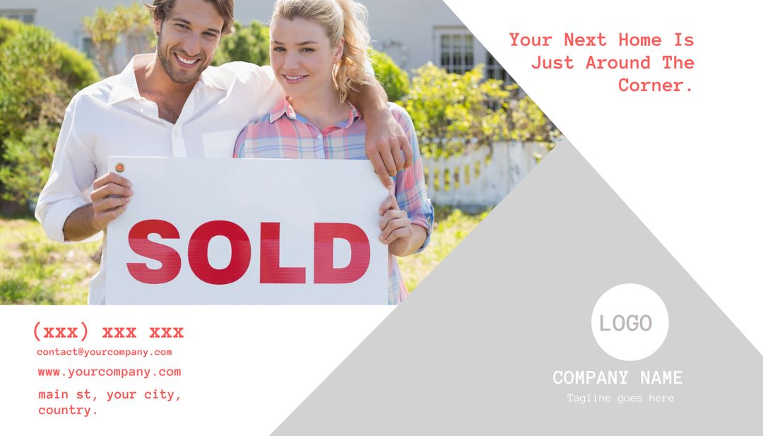 Smiling Couple Holding Sold Sign in New Home Celebration