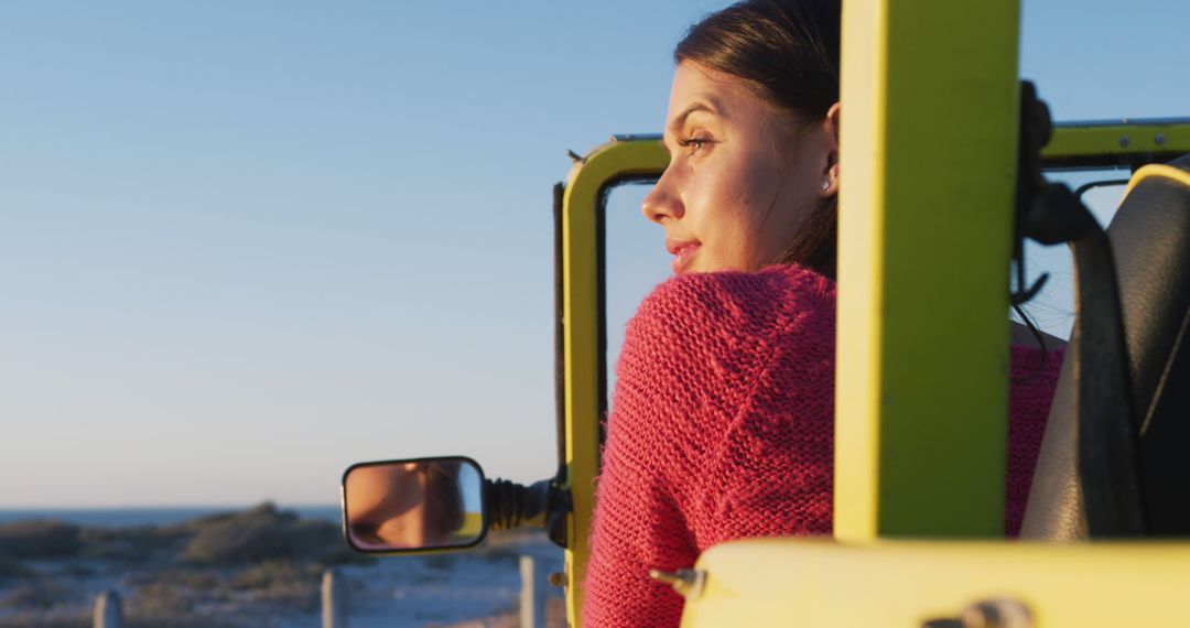 Woman Enjoying Sunset in Yellow Convertible Jeep by Beach - Free Images, Stock Photos and Pictures on Pikwizard.com