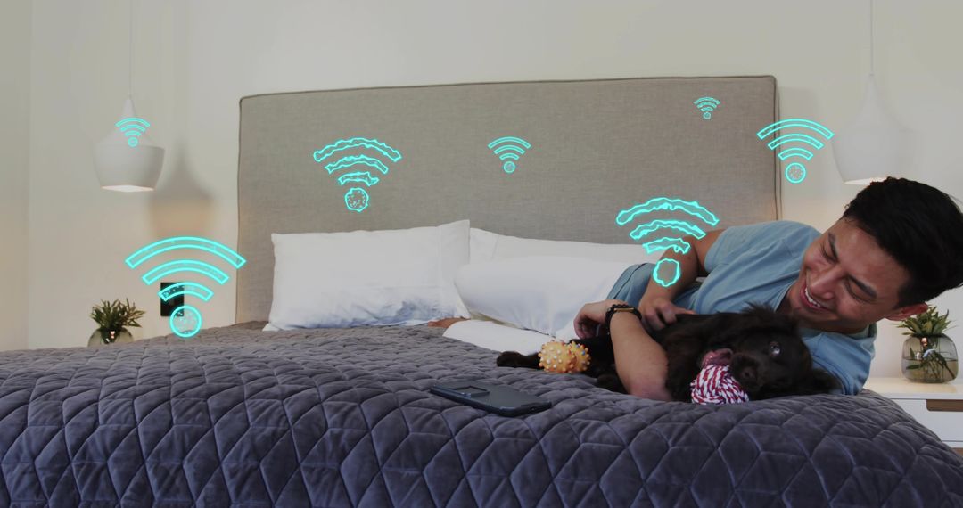 Relaxing man cuddling dog on bed while smart home Wi-Fi icons illustrating connectivity