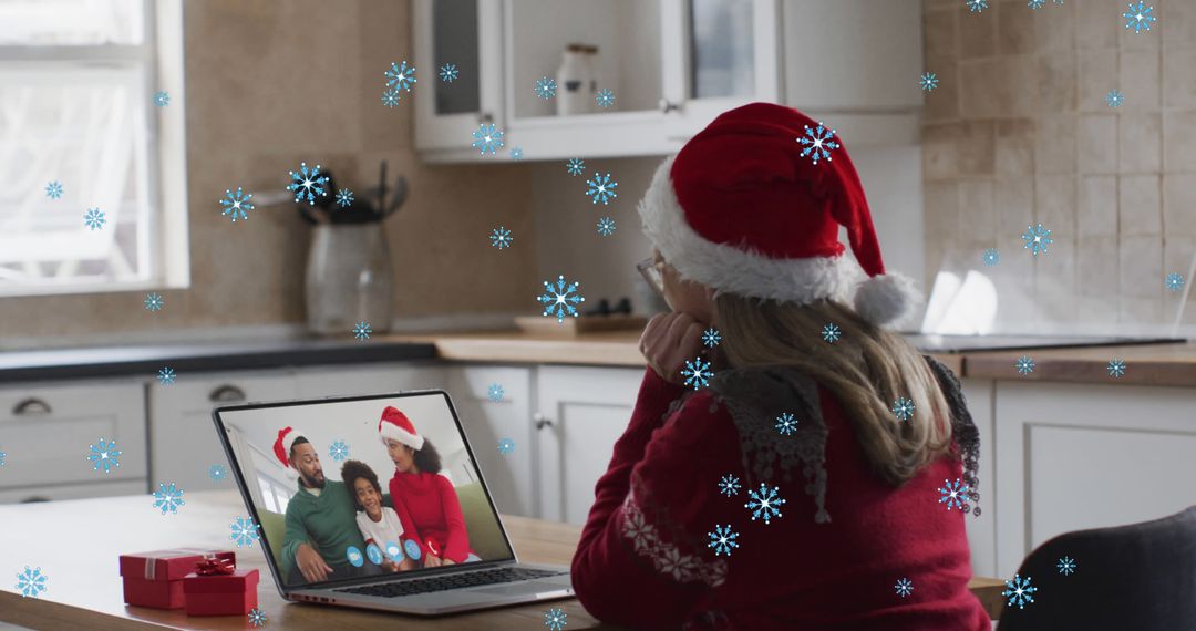 Woman in Santa Hat Video Calling Family During Christmas - Free Images, Stock Photos and Pictures on Pikwizard.com