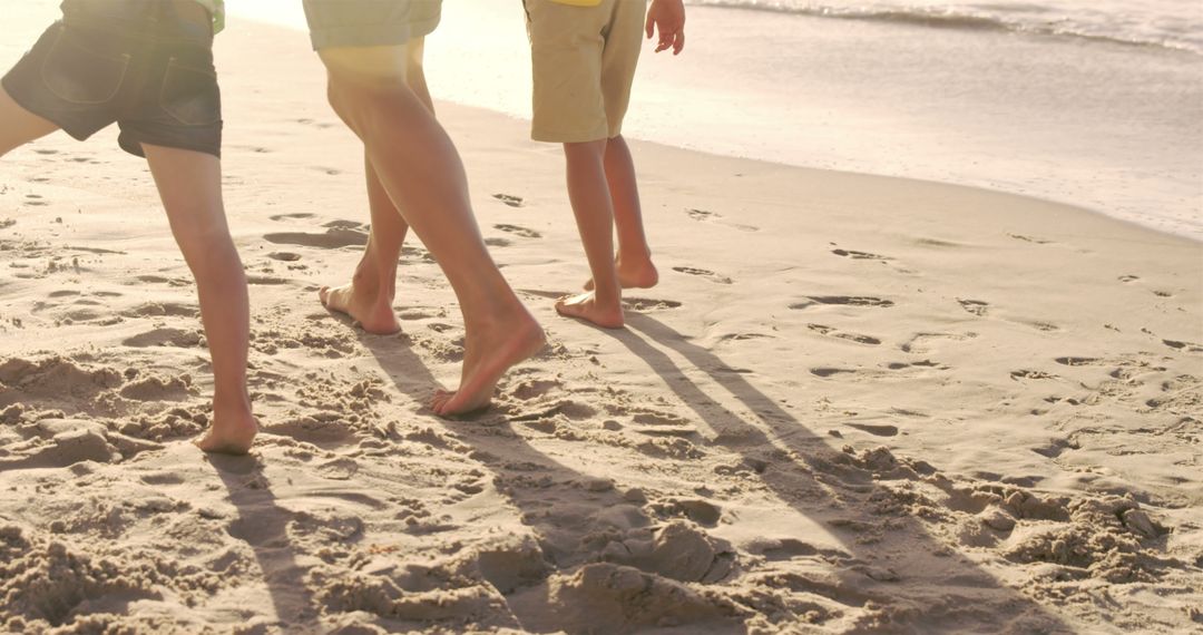 Family Walking Barefoot on Sandy Beach - Free Images, Stock Photos and Pictures on Pikwizard.com