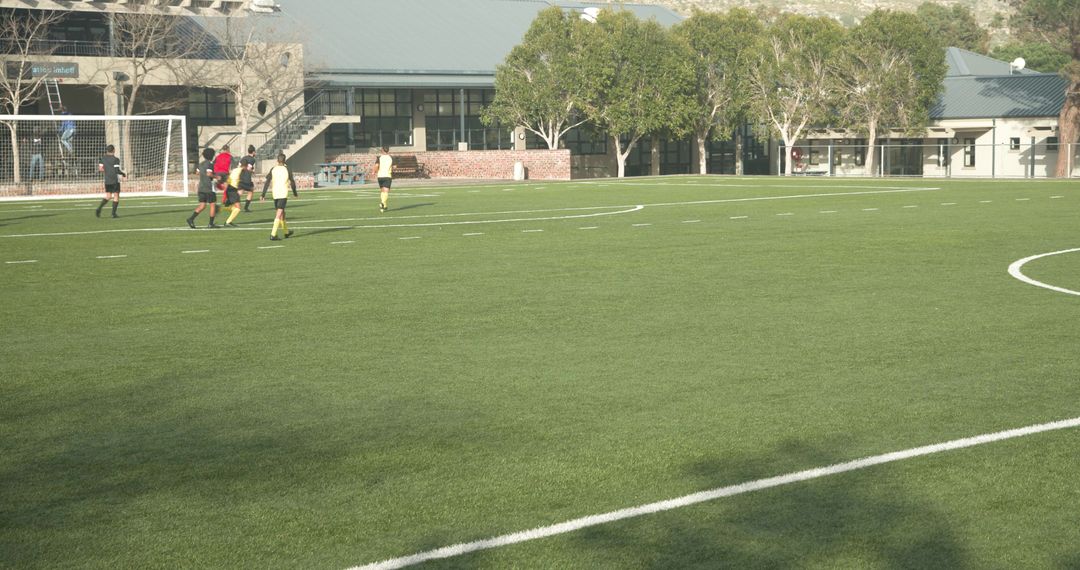 Youth Soccer Players Practice on Sunny Field Preparing for Game Day
